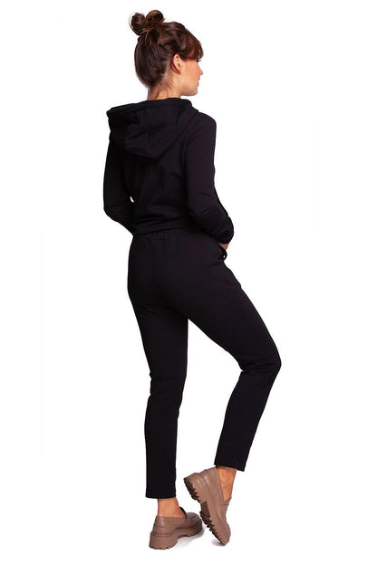 Back view of BeWear Women's Elegant Trousers with Elastic Waistband and Stylish Side Pockets worn by a model, demonstrating a sophisticated black ensemble.