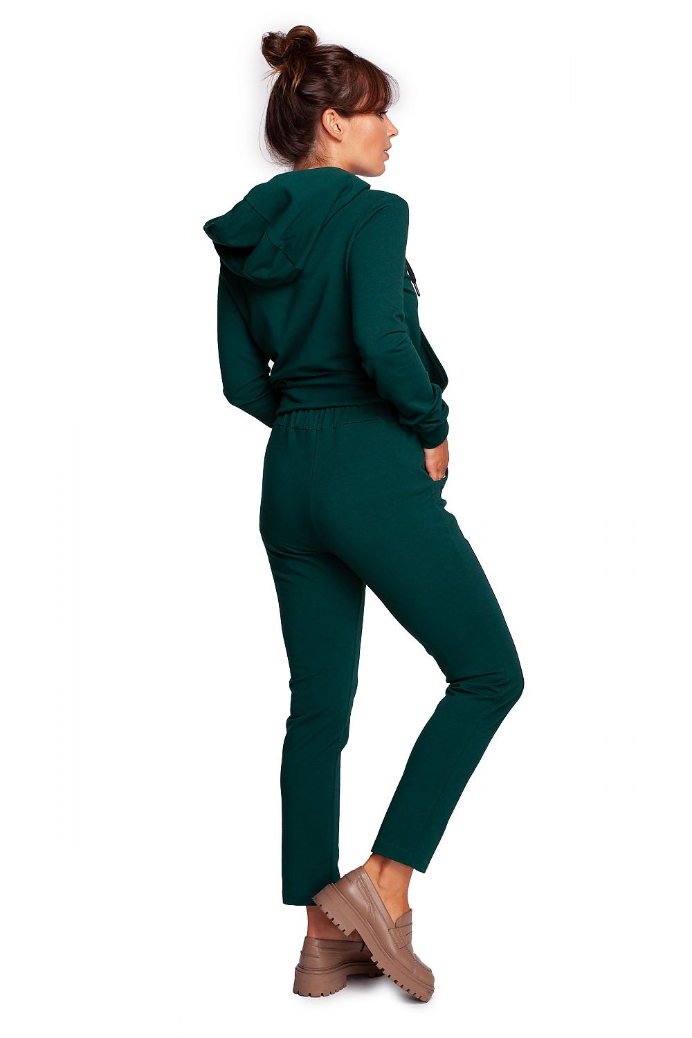 Back view of a model in BeWear Women's Elegant Trousers with Elastic Waistband and Stylish Side Pockets, wearing a luxurious green outfit with a trendy hoodie.