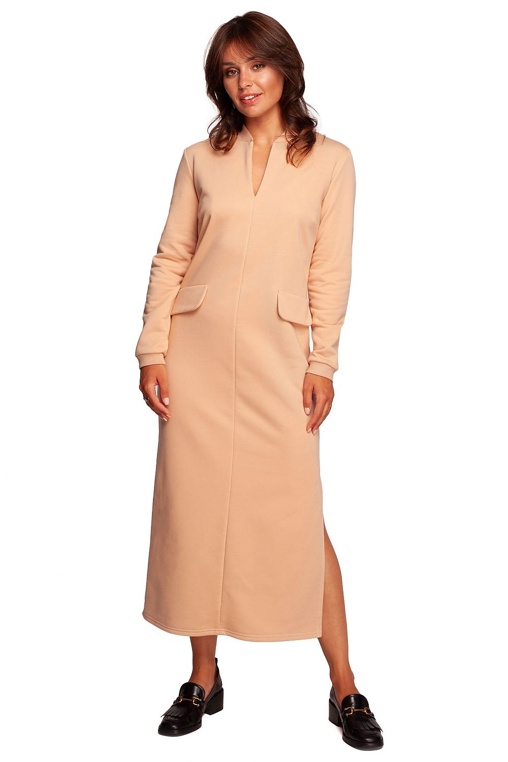 Model presenting the BeWear maxi dress with high front slit in a soft beige colour, exuding luxury and sophistication.