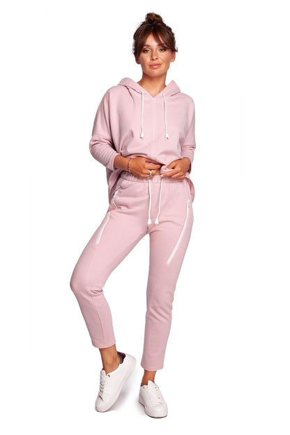 Luxury BeWear Tracksuit Trousers with Decorative Zips and Asymmetrical Stitching showcased on a model wearing a stylish pink hoodie, highlighting the comfortable knitted fabric and elegant design.
