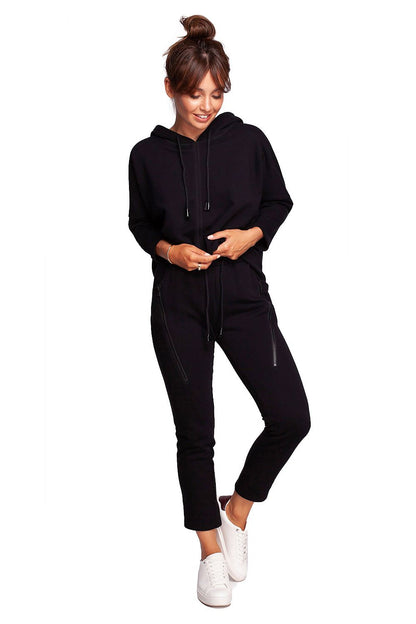 Luxury BeWear Tracksuit Trousers with Decorative Zips and Asymmetrical Stitching showcased on a model, featuring a comfortable knitted fabric and paired with a stylish hoodie for a chic loungewear look.