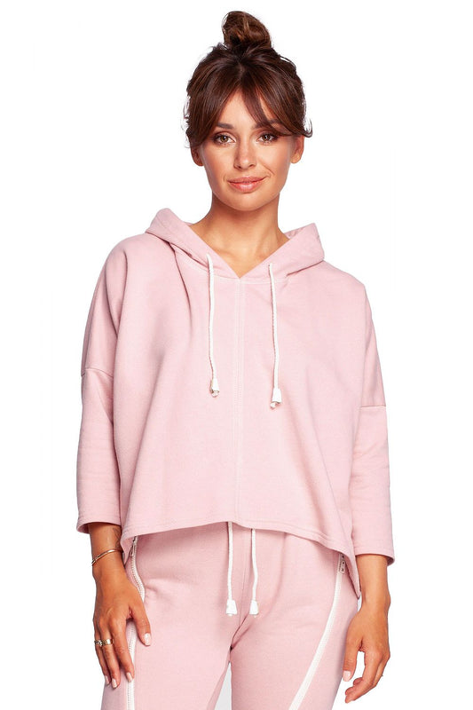 BeWear Loose-Fitting Trapeze Sweatshirt in Soft Knit with Hood and Faux Leather Accents, elegantly styled in soft pink, showcasing a casual yet sophisticated look.