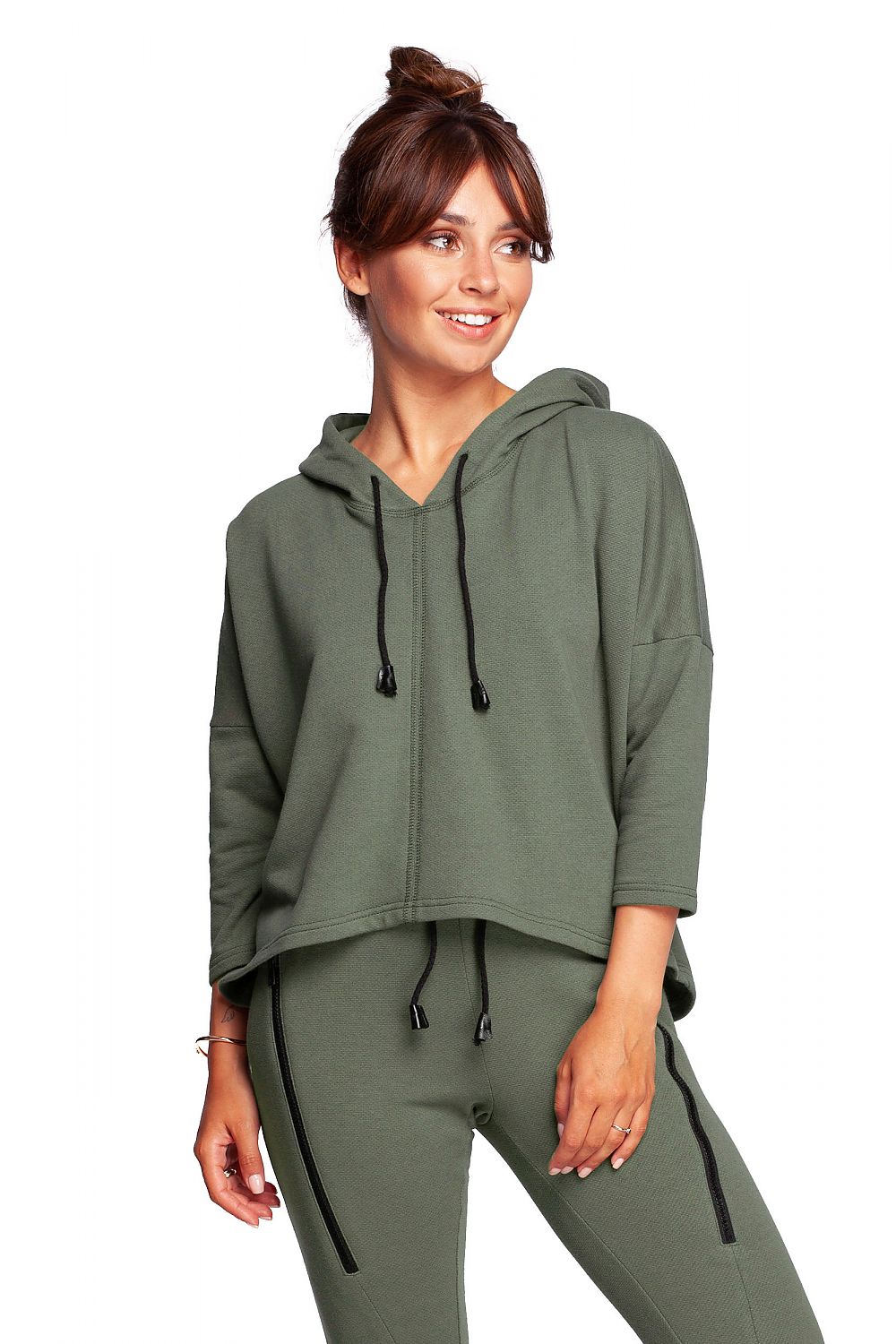 Stylish BeWear Loose-Fitting Trapeze Sweatshirt in Soft Knit with Hood and Faux Leather Accents worn by a model, highlighting a flattering green tone and relaxed fit.