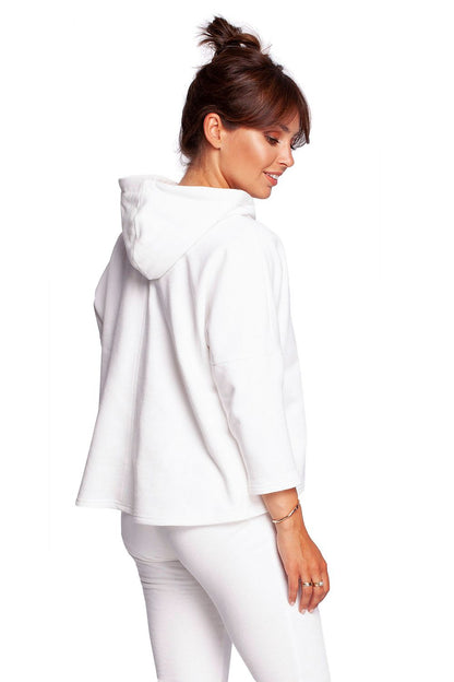 Back view of the BeWear Loose-Fitting Trapeze Sweatshirt in Soft Knit with Hood and Faux Leather Accents, highlighting the stylish hood and relaxed silhouette.