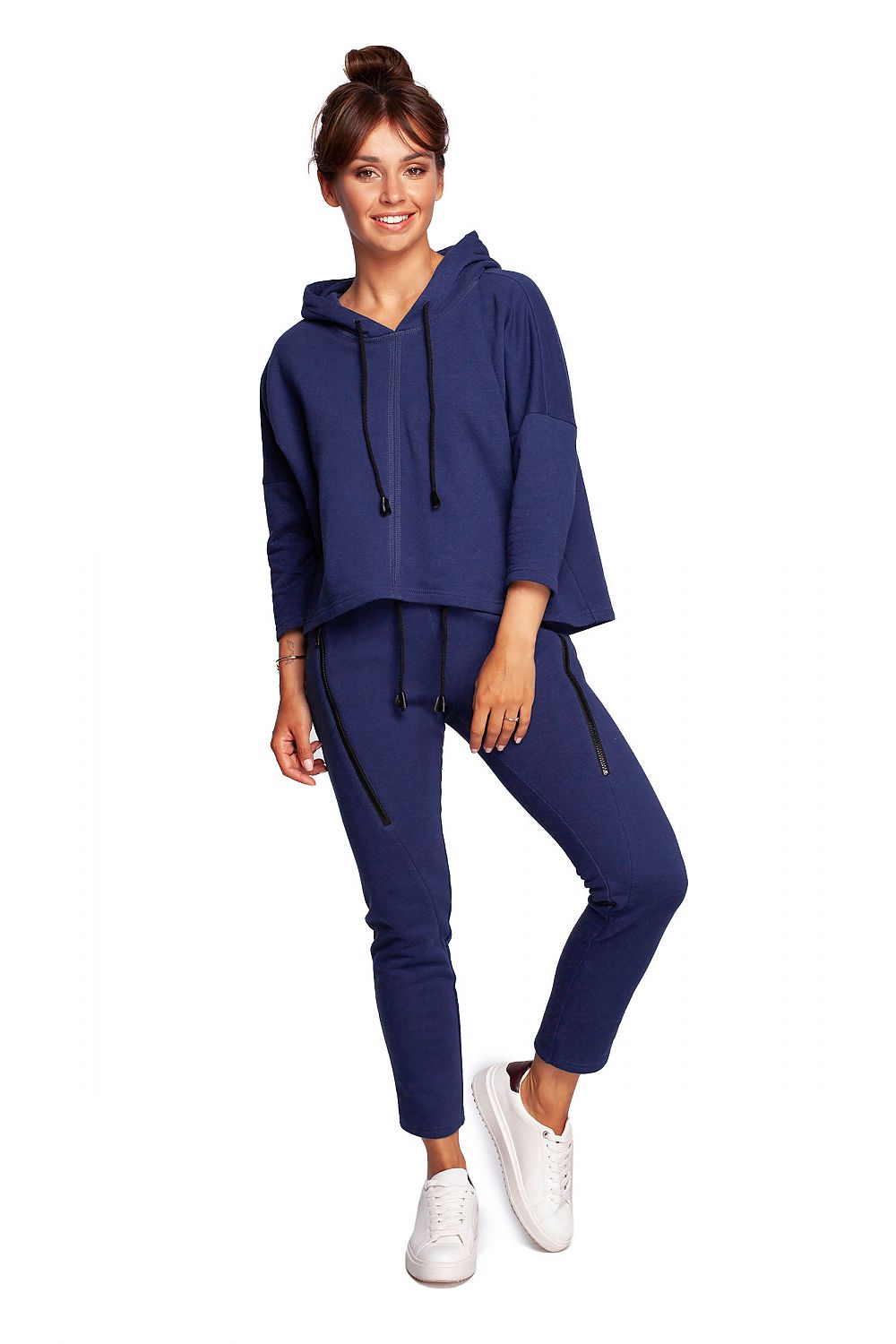 Stylish BeWear Loose-Fitting Trapeze Sweatshirt in Soft Knit with Hood and Faux Leather Accents, paired with matching trousers, displayed on a model exuding elegance and comfort.