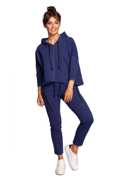 Stylish BeWear Loose-Fitting Trapeze Sweatshirt in Soft Knit with Hood and Faux Leather Accents, paired with matching trousers, displayed on a model exuding elegance and comfort.
