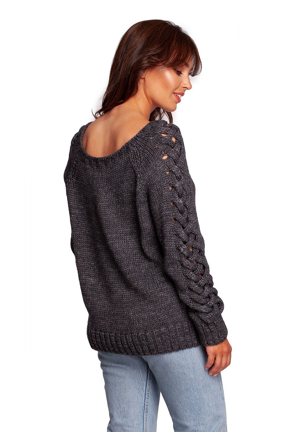 Back view of luxury fitted jumper with shoulder revealing neckline, showcasing thick plaid sleeve weave in dark grey, paired with light blue jeans.