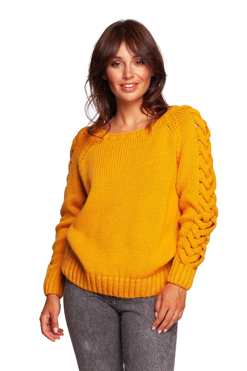 Luxury fitted jumper with shoulder revealing neckline and thick plaid sleeve weave, showcased on a model wearing a warm yellow colour, styled for autumn-winter fashion.