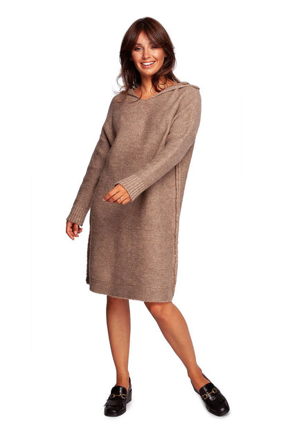 Knee-Length Hooded Knit Sweater Dress by BE Knit in warm brown, showcasing a stylish model smiling while wearing a cozy autumn sweater dress, perfect for layering and comfort.