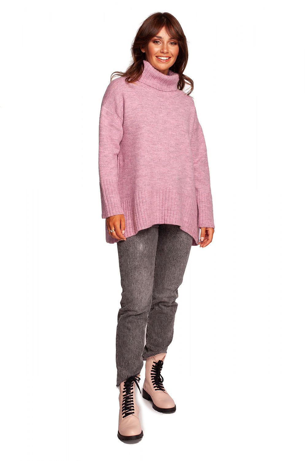 Luxury Turtleneck Knit Sweater with Ribbed Hem and Back Slit - Soft Warm Acrylic Blend, worn by a model in soft pink, featuring a stylish loose fit and elegant design.