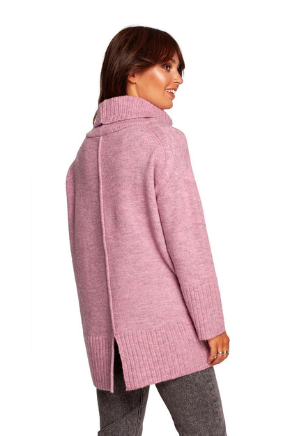 Luxury Turtleneck Knit Sweater with Ribbed Hem and Back Slit - Soft Warm Acrylic Blend, showcasing the back view of the sweater with a fashionable slit detail, model wearing soft pink.