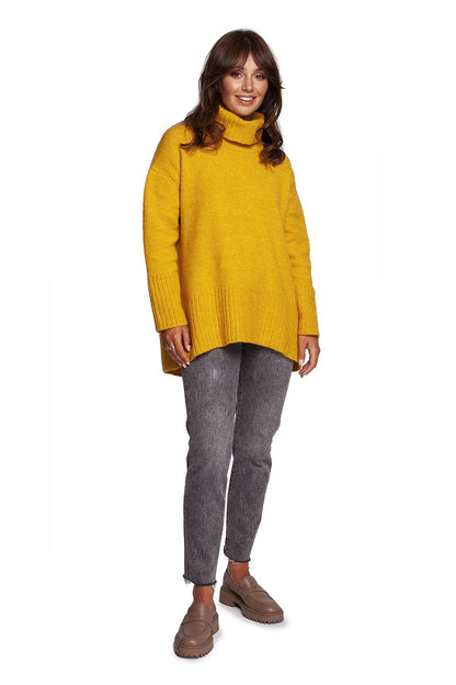 Luxury Turtleneck Knit Sweater with Ribbed Hem and Back Slit - Soft Warm Acrylic Blend, model styled in a lively yellow, exuding comfort and elegance, perfect for chilly days.