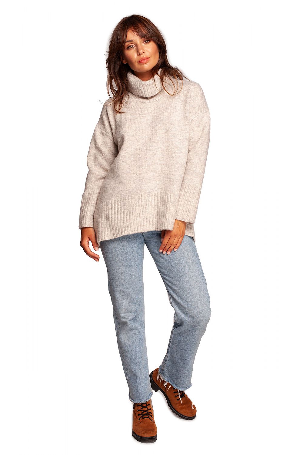 Luxury Turtleneck Knit Sweater with Ribbed Hem and Back Slit - Soft Warm Acrylic Blend, presented in a casual look with a stylish model wearing it with denim.