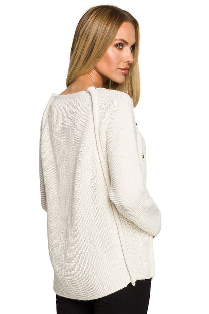 Back view of the Luxury Over-The-Shoulder Sweater With Decorative Gold Buttons by Moe, showcasing its elegant design and textured knit in a soft white colour.
