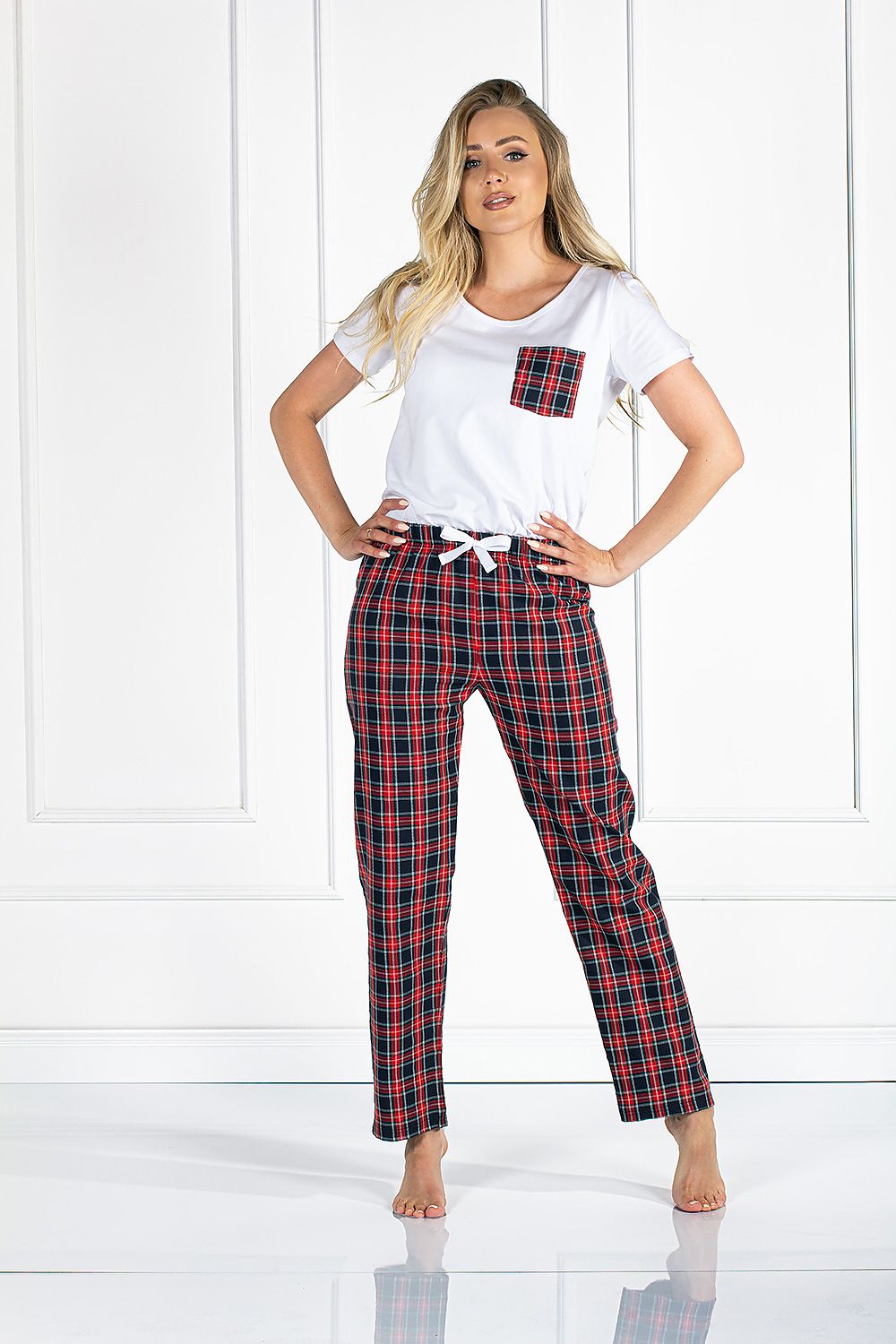 Luxury Women's Pyjama Set with Short Sleeve Blouse and Loose-Fit Long Pants featuring a model in a stylish, relaxed pose, showcasing a white blouse with a front pocket and plaid long pants.