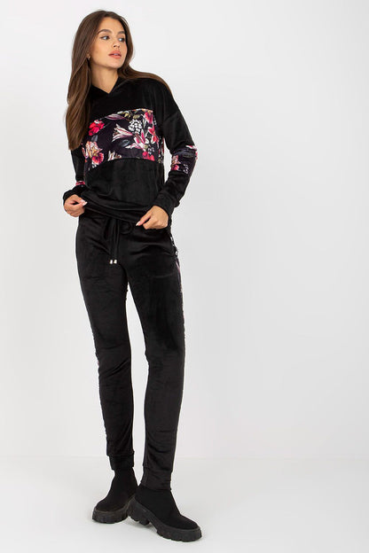Luxurious Velour Travel Set featuring an elegant black sweatshirt with floral inserts and matching long pants, ideal for stylish travel.