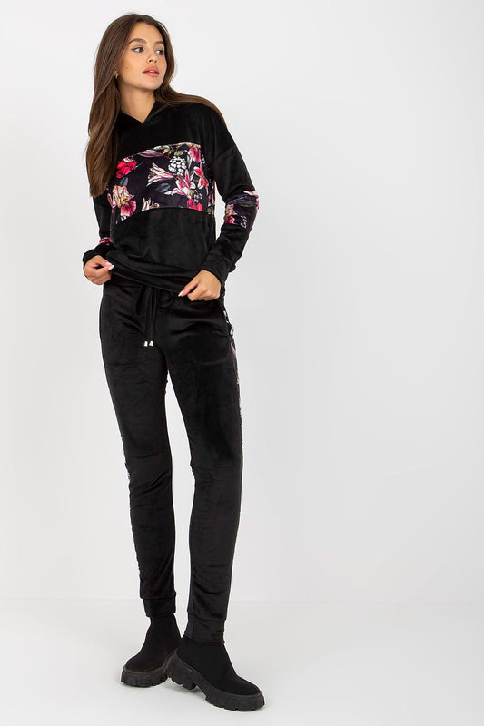 Luxurious Velour Travel Set featuring an elegant black sweatshirt with floral inserts and matching long pants, ideal for stylish travel.