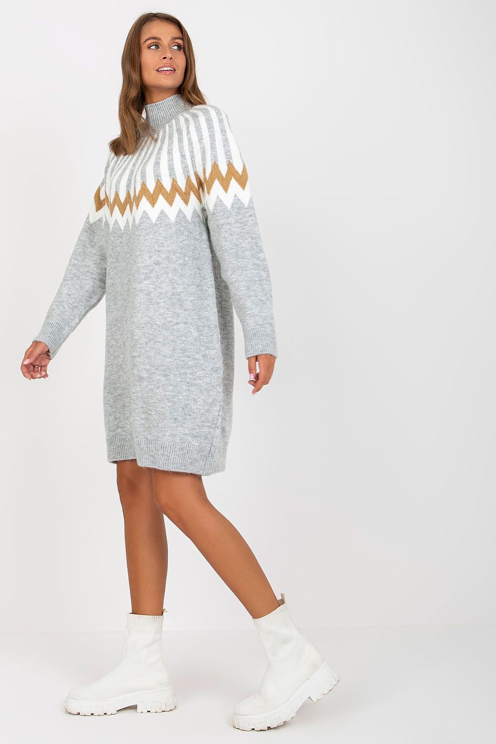 Chic grey knitted daydress with a contemporary geometric pattern and long sleeves, featuring a stylish turtleneck, perfectly paired with white heeled boots by Rue Paris.