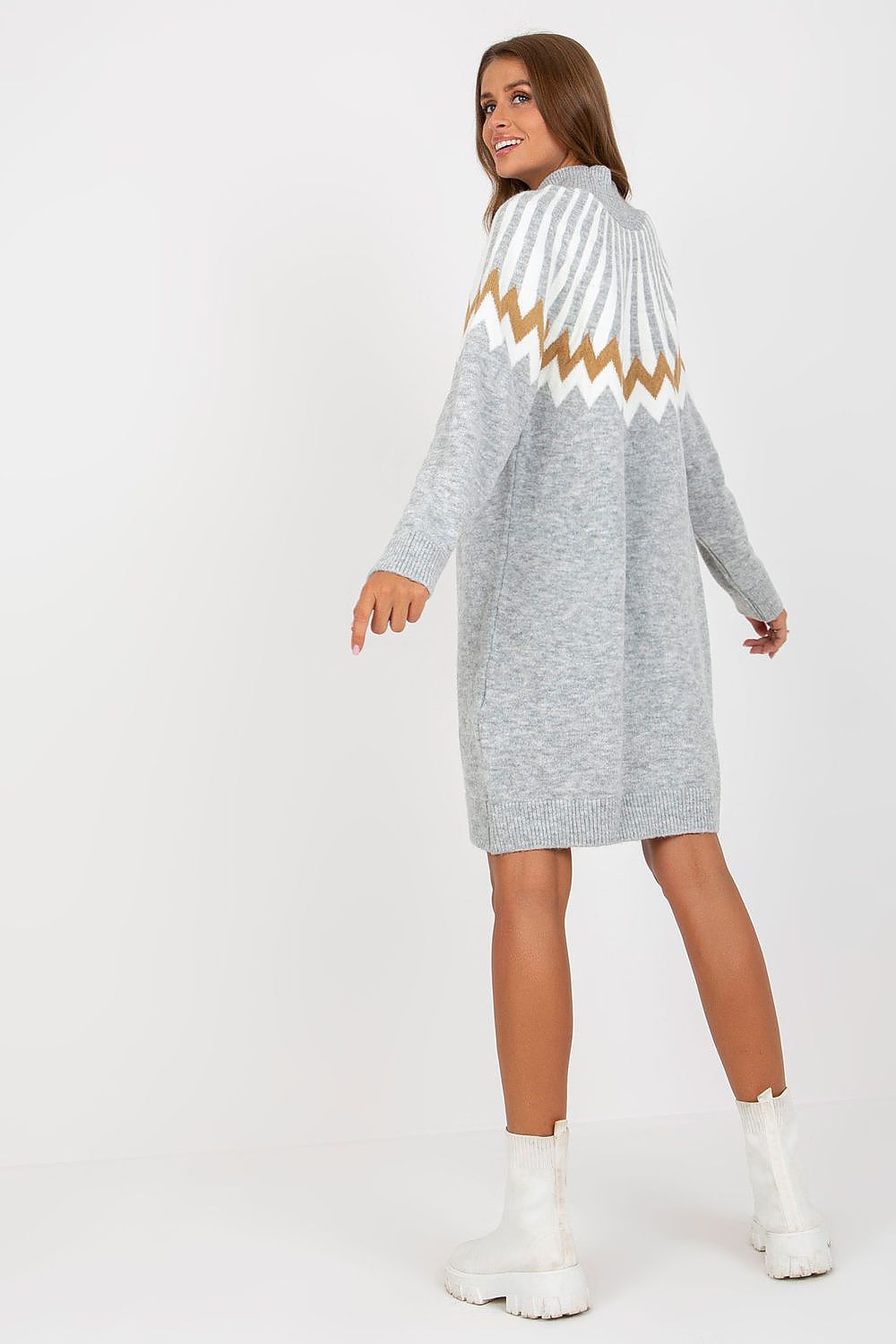 Refined back view of a grey geometric knitted daydress with long sleeves and turtleneck by Rue Paris, stylishly showcased with white ankle boots.