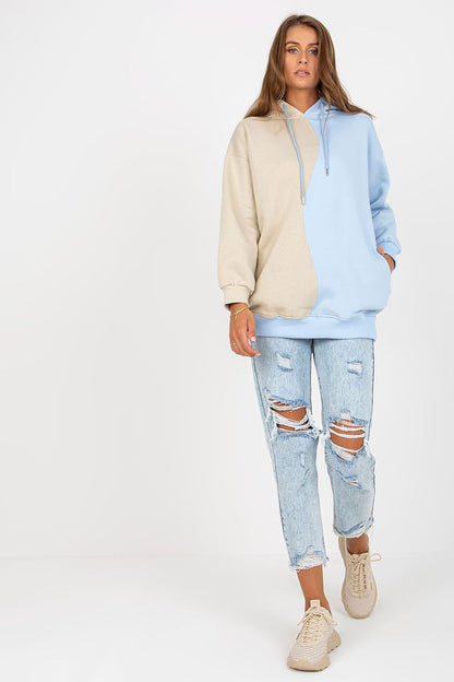 Model wearing the Luxurious Two-Colour Women's Hoodie Sweatshirt by Rue Paris, paired with distressed jeans, exuding a fashionable, casual vibe.