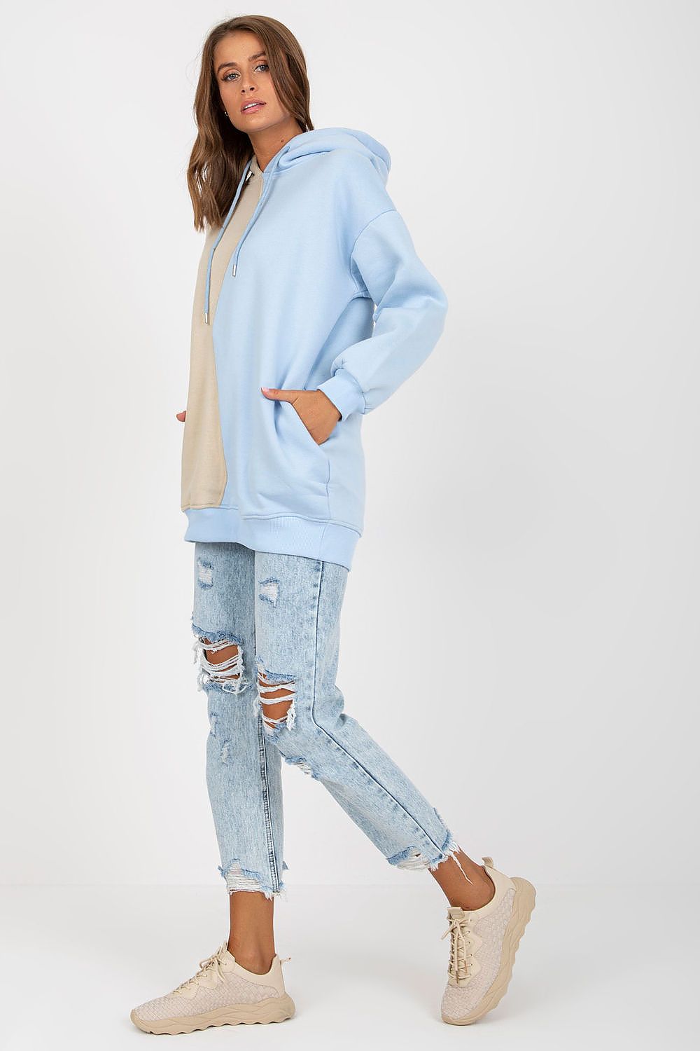 Luxurious Two-Colour Women's Hoodie Sweatshirt by Rue Paris with Slip Pockets, featuring a light blue and beige design, elegantly styled with ripped jeans and casual footwear.