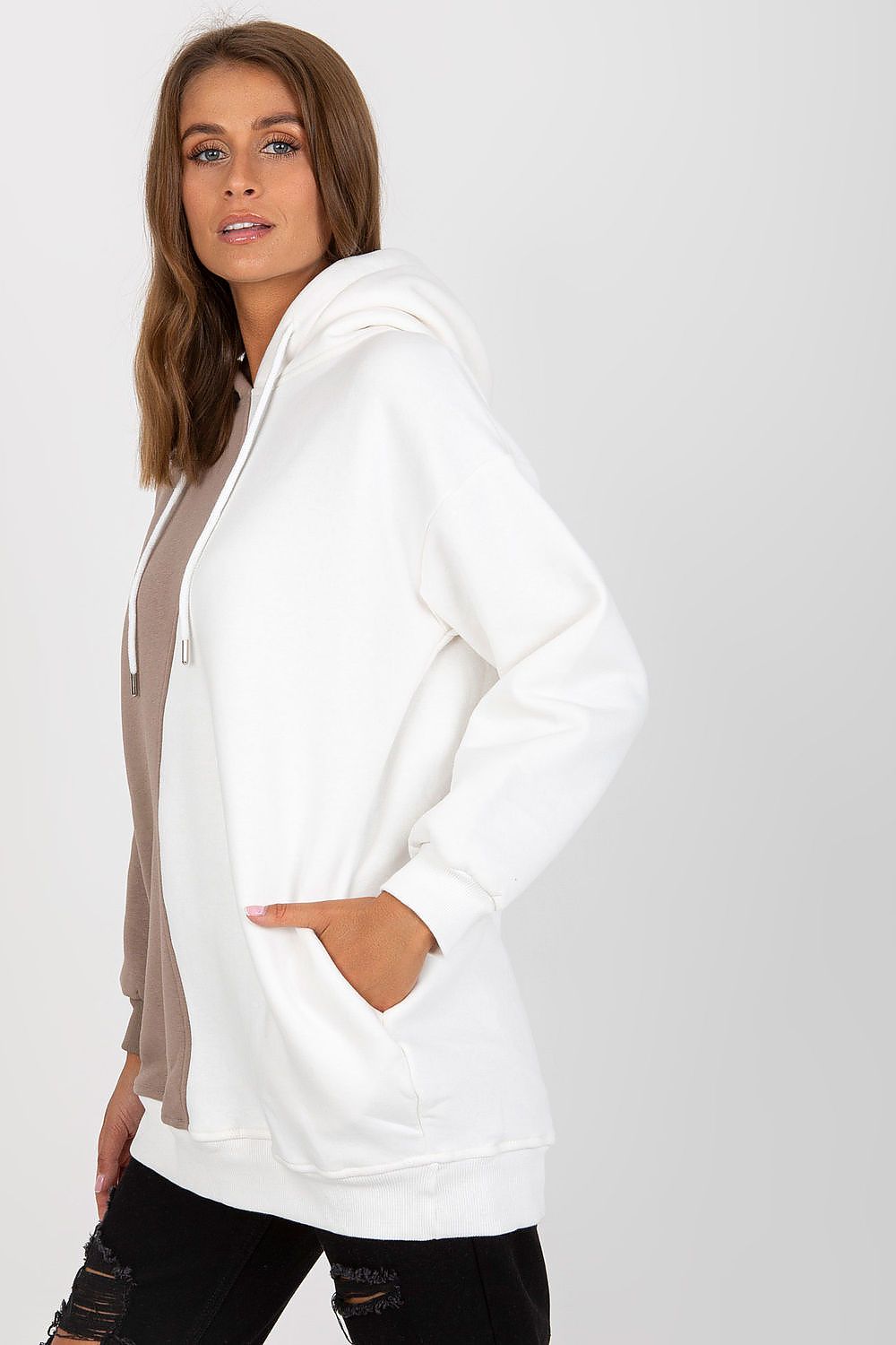 Luxurious Two-Colour Women's Hoodie Sweatshirt by Rue Paris with Slip Pockets, elegantly draped in white and brown hues, complemented by fashionable distressed black trousers.