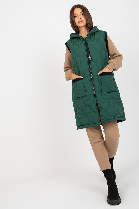 Luxurious Quilted Hooded Gilet by Rue Paris, showcased on a model, featuring a stylish green insulated vest with zippered pockets and a hood, perfect for chic autumn outfits.