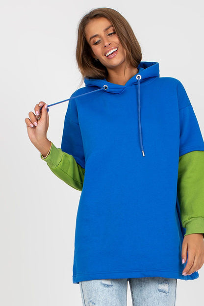 Luxury Women's Rue Paris Cotton Blend Sweatshirt with Hood, Extended Cut and Long Sleeves, featuring vibrant blue and green colour contrast while the model smiles.