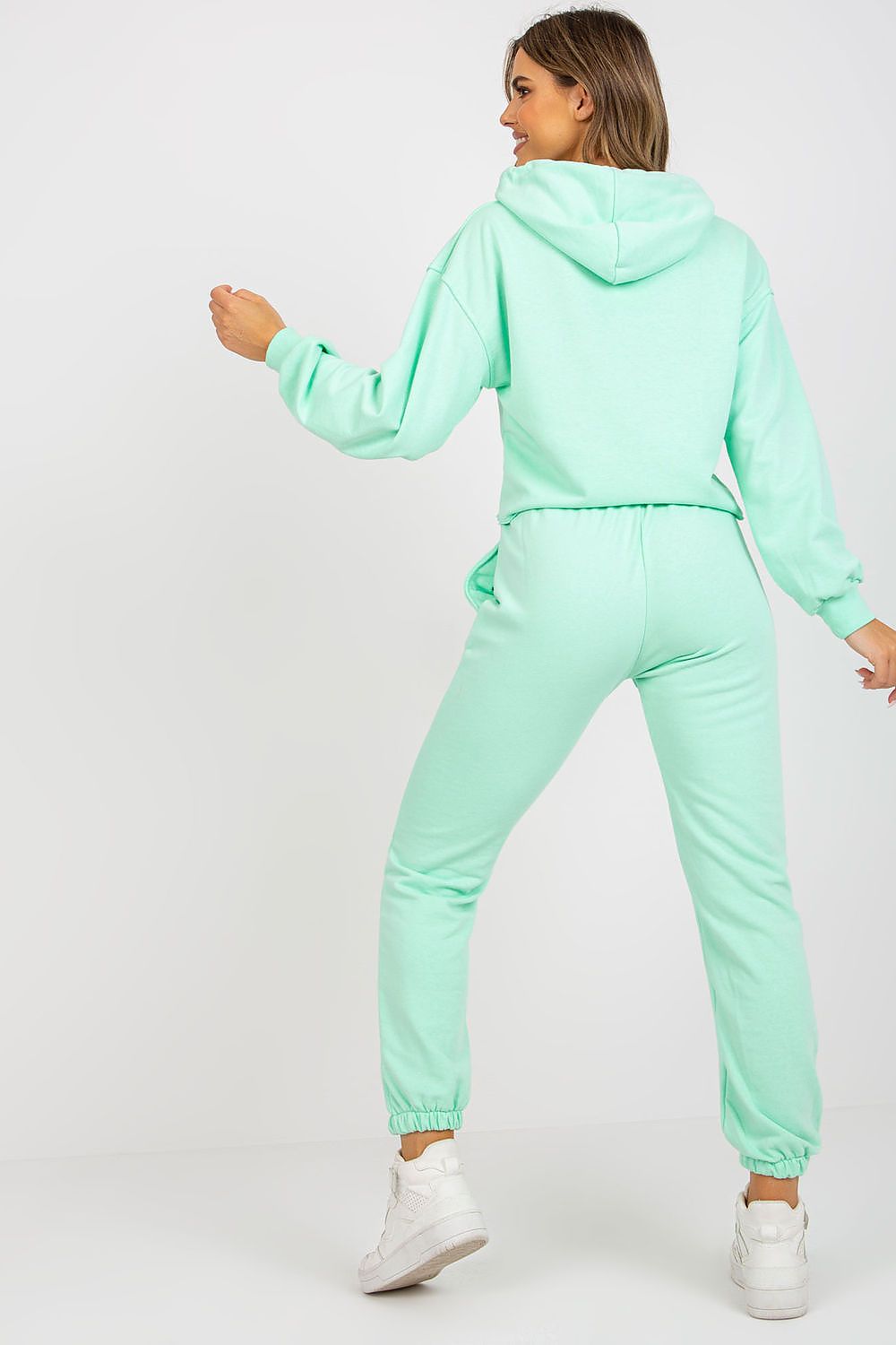 Luxury Ex Moda Sweatshirt Set With Hooded Long Sleeve Top And High Waist Pants, back view of model displaying the mint green set with a cozy hooded sweatshirt and elegant high waist pants.