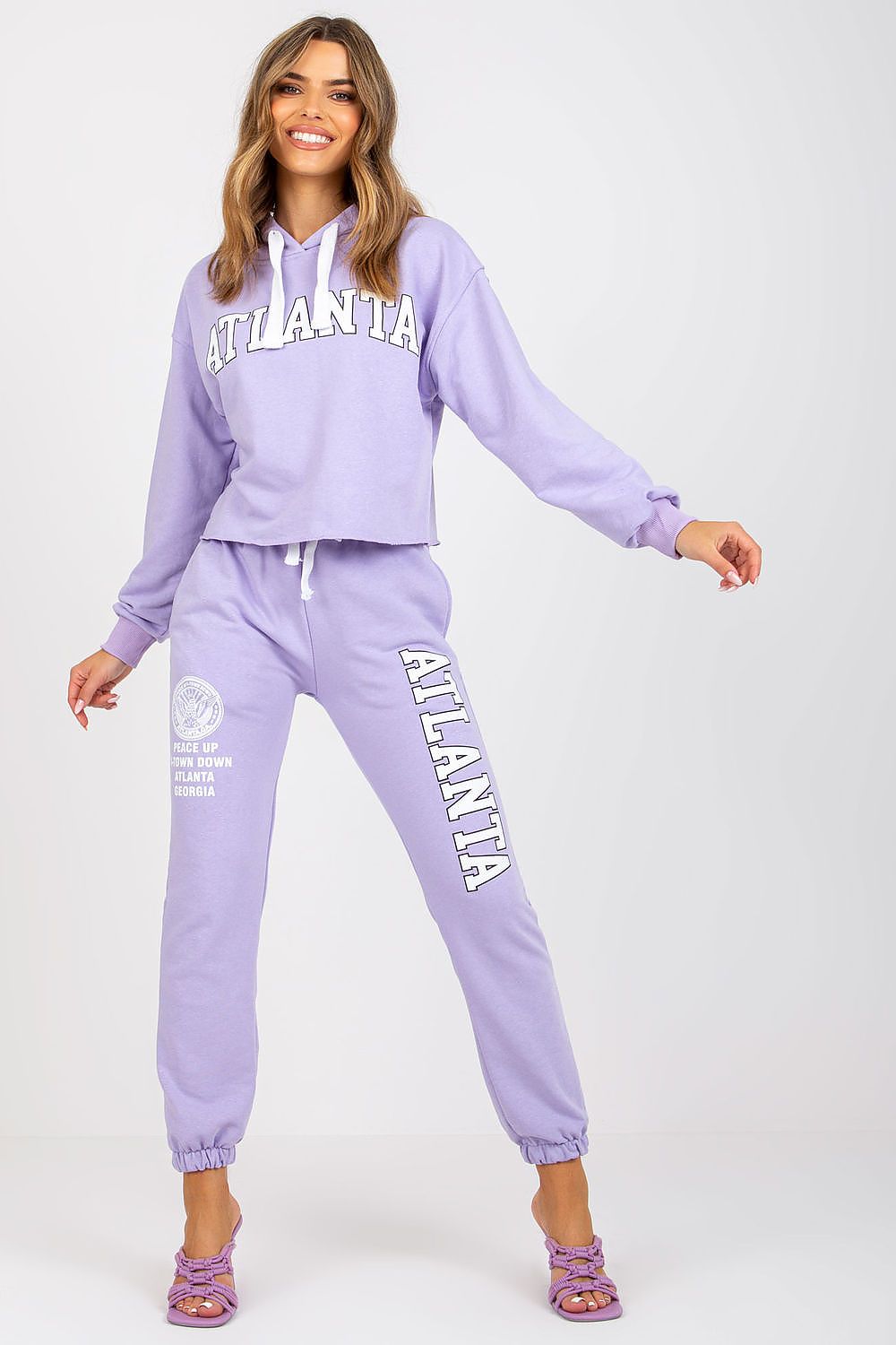 Luxury Ex Moda Sweatshirt Set With Hooded Long Sleeve Top And High Waist Pants, model gracefully wearing a lavender set featuring a cropped hoodie and matching high waist pants.