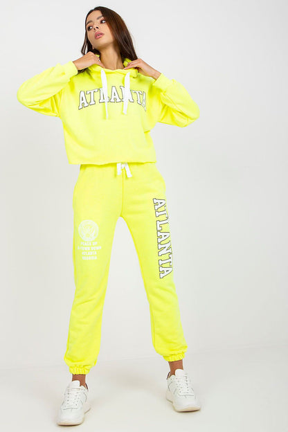 Luxury Ex Moda Sweatshirt Set With Hooded Long Sleeve Top And High Waist Pants in bright neon yellow, model displaying a chic look with confidence and style.