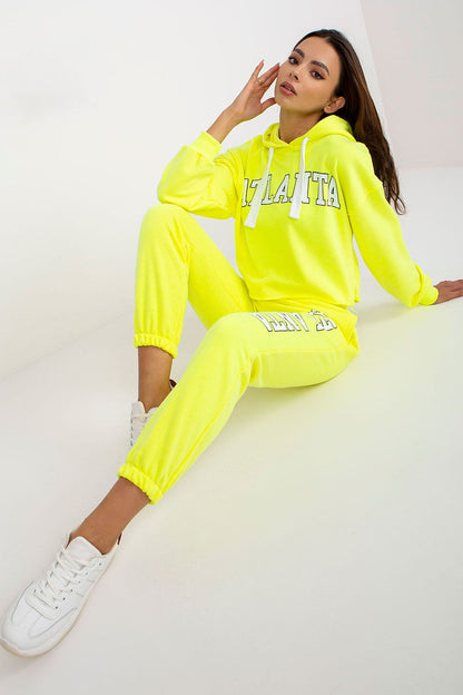 Luxury Ex Moda Sweatshirt Set With Hooded Long Sleeve Top And High Waist Pants in neon yellow, model expressing a relaxed vibe while showcasing the contemporary design.