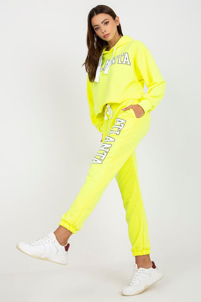 Luxury Ex Moda Sweatshirt Set With Hooded Long Sleeve Top And High Waist Pants styled in neon yellow, model posing gracefully highlighting the modern silhouette.