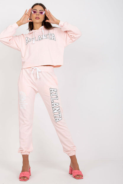 Luxury Ex Moda Sweatshirt Set With Hooded Long Sleeve Top And High Waist Pants in pink, featuring a cropped hoodie and matching high-waisted sweatpants, styled with pink heels.