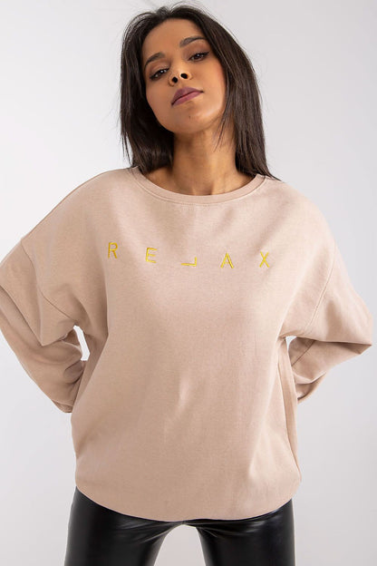 Elegant Ex Moda Women’s Long Sleeve Blouse with Round Neckline and Decorative Embroidery, showcasing a chic and relaxed fit on a model. Perfect for luxurious casual wear.