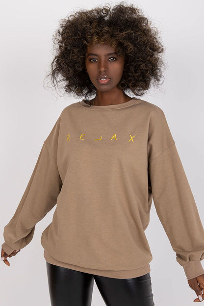 Sophisticated take on Ex Moda Women's Long Sleeve Blouse, featuring round neckline and dynamic decorative embroidery, presented in a fashionable tan colour, showcasing luxury leisurewear.