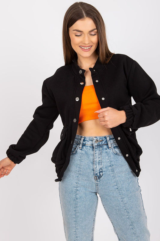 Elegant Ex Moda Women's Long Sleeve Hooded Sweatshirt with Snap Fastening and Pockets, styled with casual chic denim, perfect for a luxurious wardrobe.