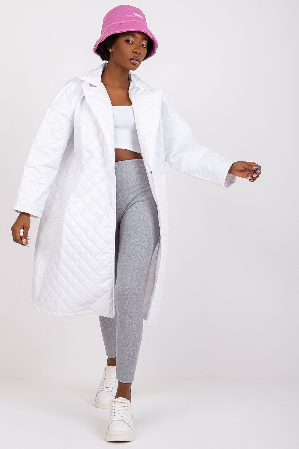 Ex Moda Quilted Long Sleeve Coat in 100% Polyester, styled elegantly with a white crop top and grey leggings, exuding a luxurious vibe.