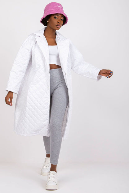 Ex Moda Quilted Long Sleeve Coat in 100% Polyester, styled elegantly with a white crop top and grey leggings, exuding a luxurious vibe.