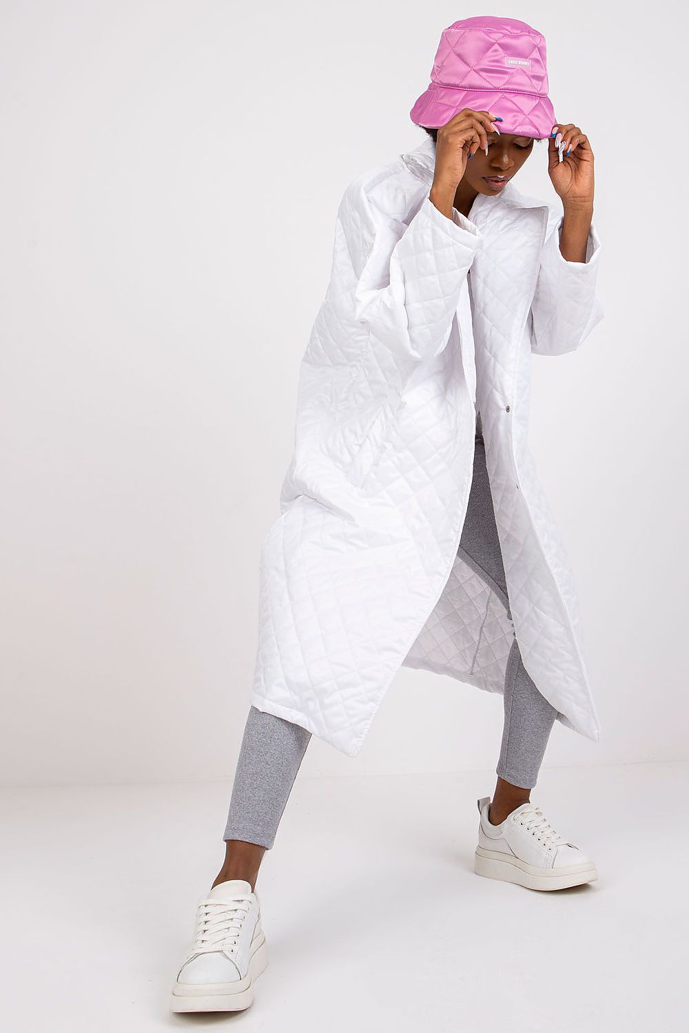 Chic Ex Moda Quilted Long Sleeve Coat in 100% Polyester, showcased with a stylish pink bucket hat, reflecting sophistication and modern fashion.