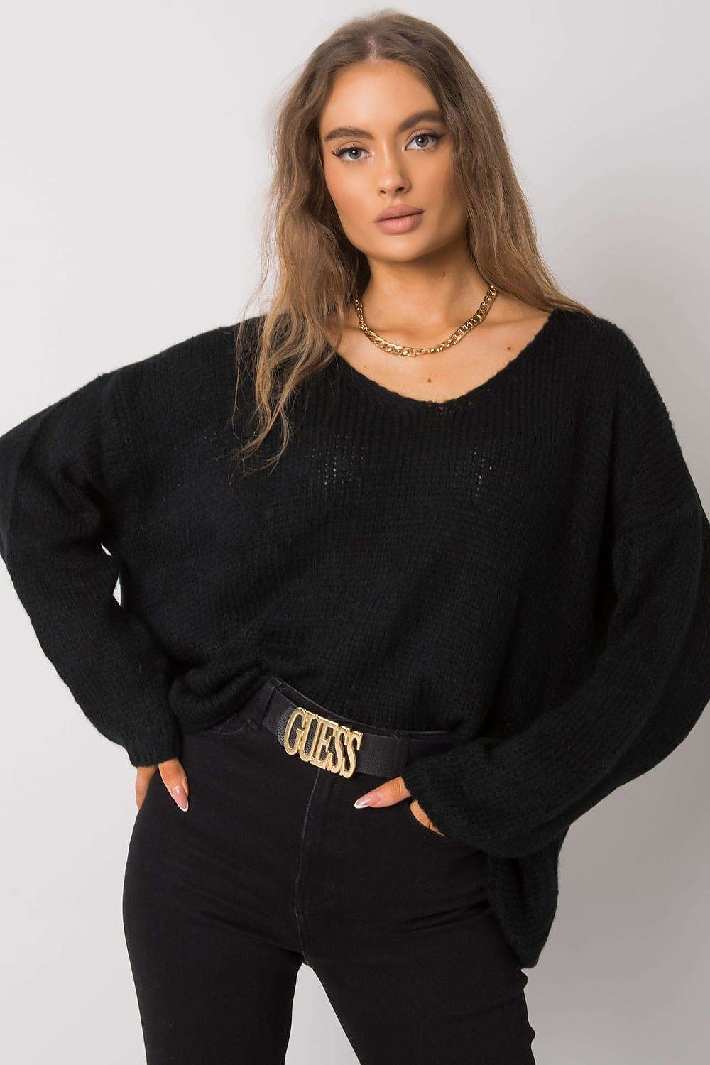 Fashion-forward Women's Och Bella Sweater in black, featuring long sleeves and a heart neckline, designed with a trendy asymmetrical cut for an elegant appearance.