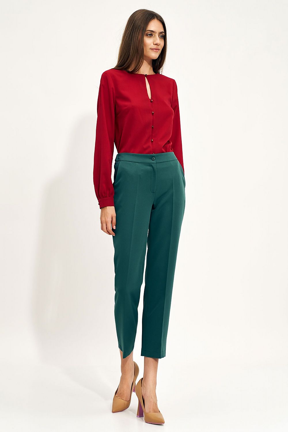 Chic ensemble featuring the Nife Teardrop Long Sleeve Shirt with Unique Neckline for Elegant Office Styling, complemented by green tailored trousers, presenting a luxurious office fashion statement.