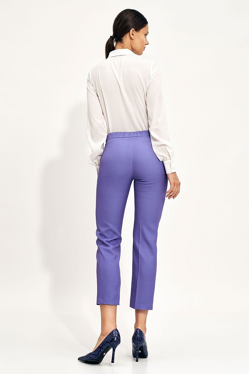 Back view of the Elegant Long Sleeve Bow Shirt by Nife styled with elegant purple trousers, embodying modern sophistication for office wear.