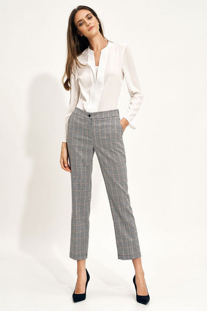 Nife Women's Chino Trousers with Elastic Waistband and Pockets - Elegant Fit for Modern Style, featuring a smart-casual woman in stylish check trousers and a sleek blouse.