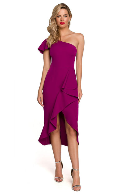 Elegant One Shoulder Makover Cocktail Dress with Overlap Design, showcased by a glamorous model in a striking fuchsia colour, perfect for special occasions. This beautiful dress features a sophisticated one-shoulder design and an elegant overlap bottom, emphasising a chic silhouette.