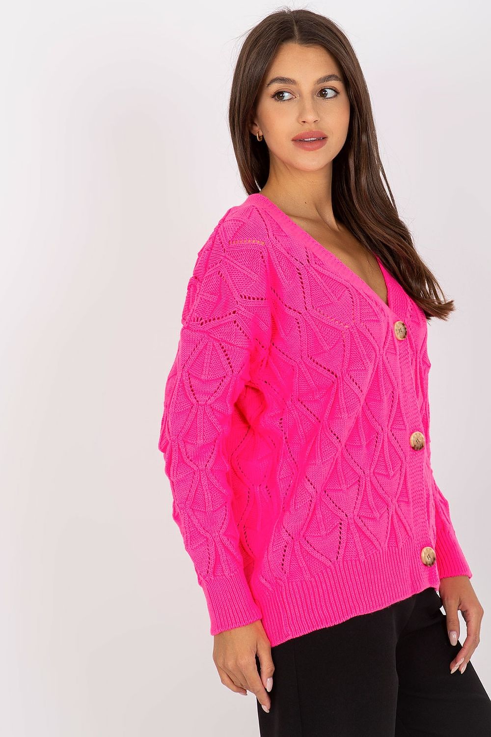 Luxurious Women's Button-Down Cardigan Sweater by Rue Paris with Openwork Pattern, displayed in a relaxed stance, offering a side view of the elegant pink sweater and its stylish openwork knit.