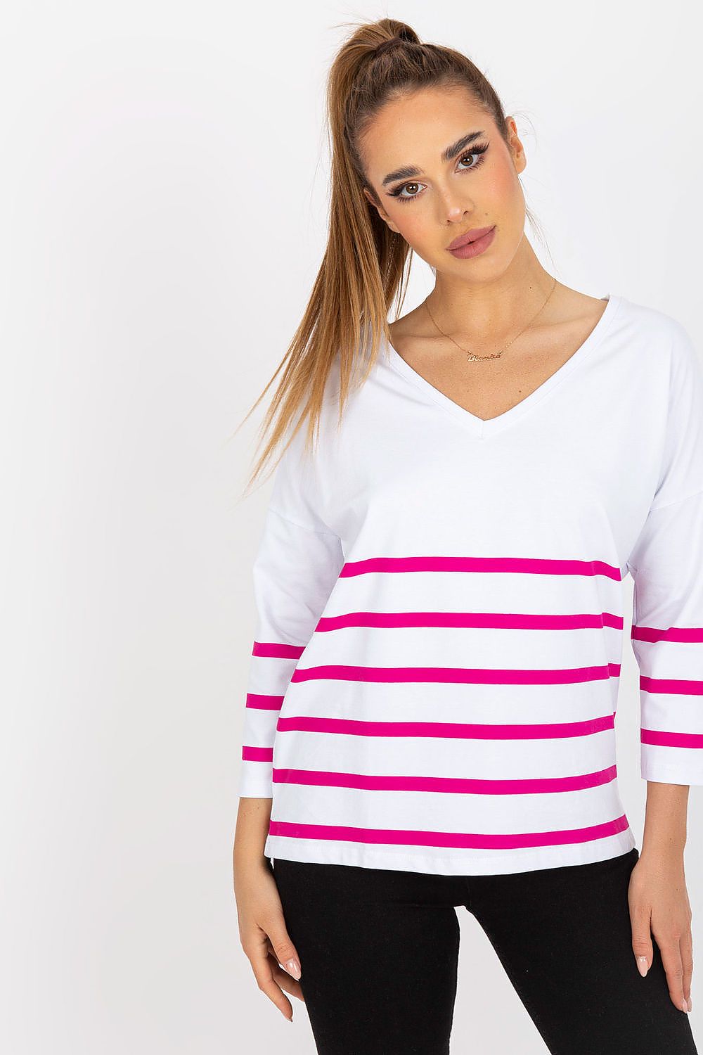 Elegant Rue Paris Blouse with 3/4 sleeves and heart neckline, adorned with a striking pink stripe design, elegantly paired with black trousers for a sophisticated appearance.