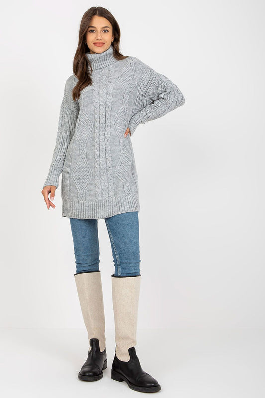 Luxurious Rue Paris Women's Long Turtleneck Jumper in soft grey acrylic and wool blend, styled with denim jeans and knee-high boots for a chic autumn look.