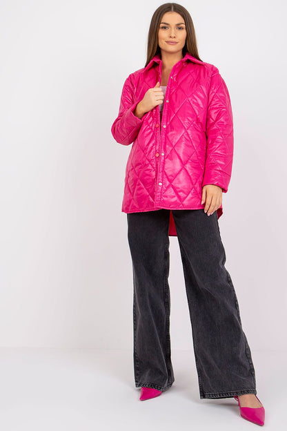 Elegant Women's Quilted Jacket by Rue Paris in vibrant pink, featuring long sleeves and a relaxed silhouette, styled with high-waisted denim trousers and pink heels, showcasing a chic transitional look.