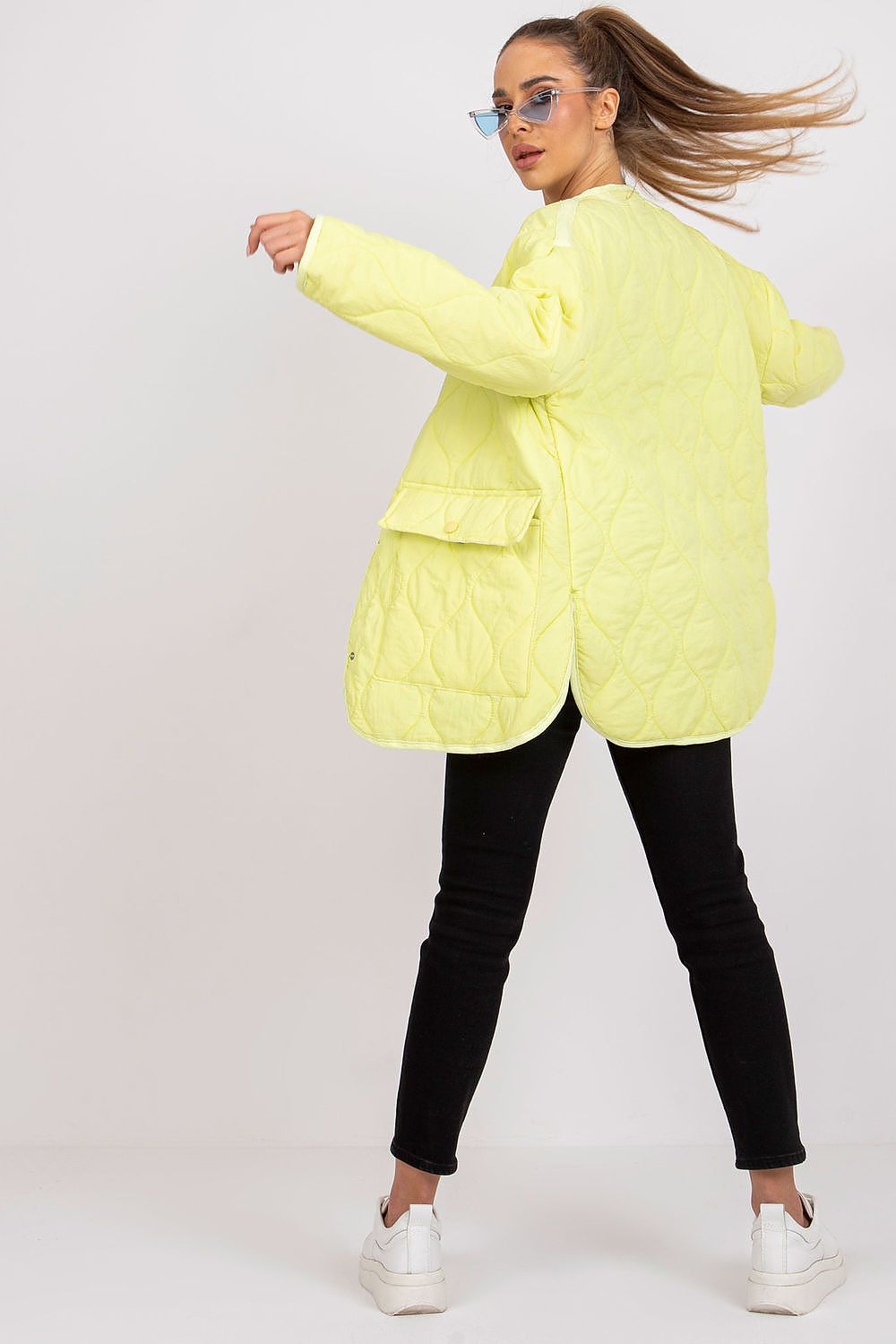 Stylish Rue Paris Women's Quilted Transitional Jacket in a stunning yellow hue, featuring a relaxed silhouette and oversized pockets, ideal for an upscale, urban look.
